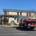 The Pine Bush Fire Dept. helps the Knights change out the sash for Easter.