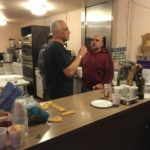 L to R: Brother Knights Joe LeClair and Mike Grasso taking a break in kitchen.