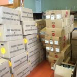 Every month the Saint Mary's Outreach program distributes between 2-3 tons of food to the needy. Everything comes in semi-sorted boxes that have to be unloaded and sorted out according to station.