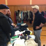 Brother Knights (l to r) Mike Fenick, Matt Rommel, and DGK Joe Ditizio help out at a clothing station for the needy.