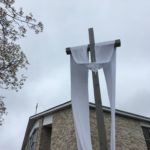 The Easter Sash is on the Crucifix in front of the Blessed Mother Grotto at the Church of the Infant Saviour in Pine Bush, NY.