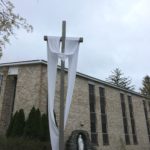 The Easter Sash is on the Crucifix in front of the Blessed Mother Grotto at the Church of the Infant Saviour in Pine Bush, NY.