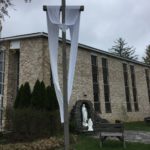 The Easter Sash is on the Crucifix in front of the Blessed Mother Grotto at the Church of the Infant Saviour in Pine Bush, NY.