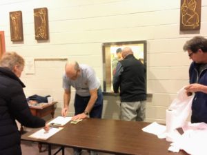 Brother Knights Ray Perry, Mike Finnegan, and Bob Yackel getting orders packed up for "to go".