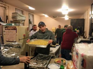 Brother Knight Nic Grasso posing with our freshly boiled pasta. Brothers Matt Rommel, Joe LeClair, and Mike Grasso working the kitchen in the background.