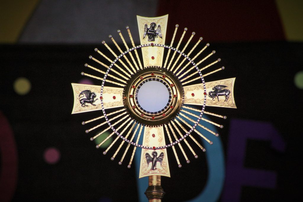 The monstrance holds the blessed Eucharist for adoration by the faithful.