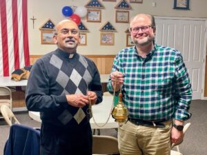 Grand Knight Chris Welch with Church of the Infant Saviour Pastor Father Rodrigo and the new thurible our Council donated to the church.
