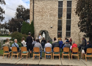 Parishioners of Church of the Infant Saviour and the Knights of Columbus Monsignor James S. Conlan Council #5329 gather to say the Rosary together in the Church Grotto.